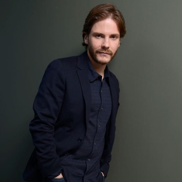 Daniel Bruhl modelling for camera